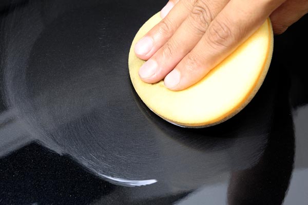 Hand Waxing a Car With Paste