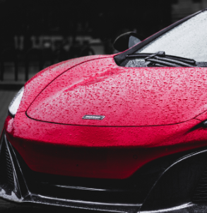 Red Car with Water Droplets